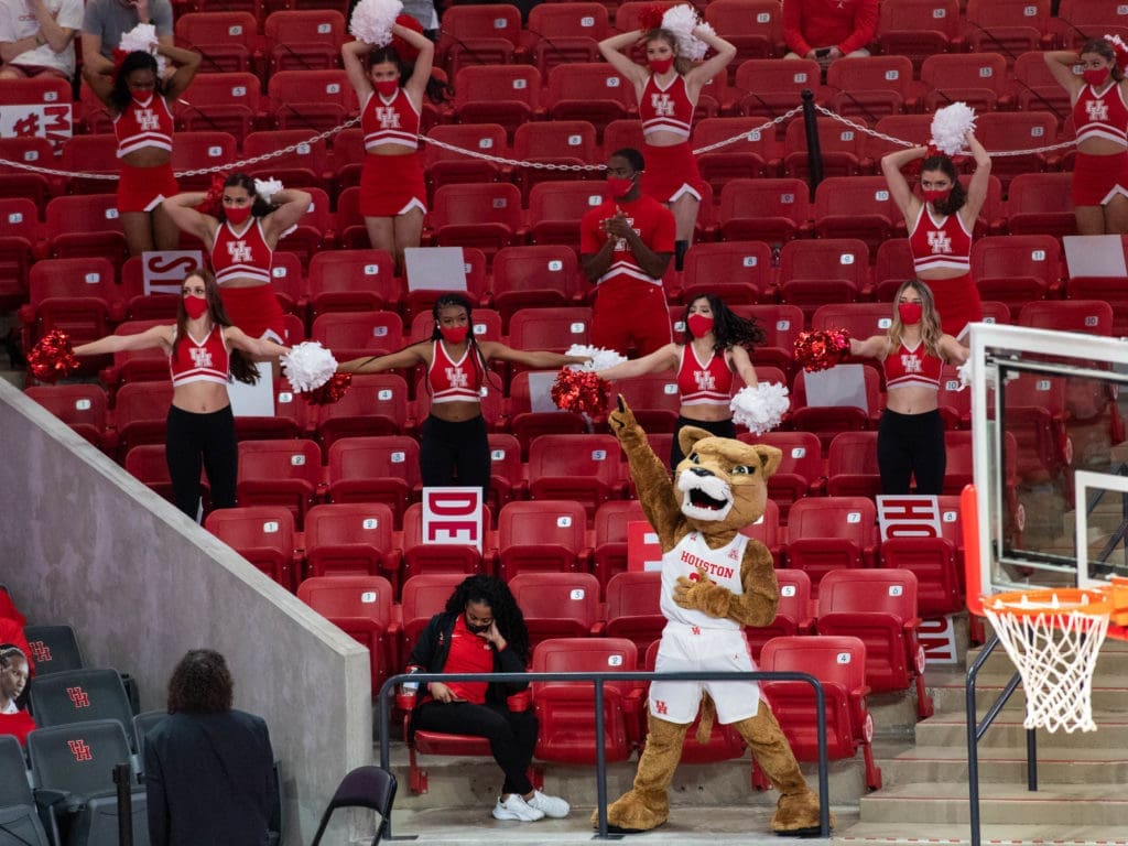 Houston's cheerleaders cheer for the basketball team from the stands in this COVID season. (Photo by F. Carter Smith)