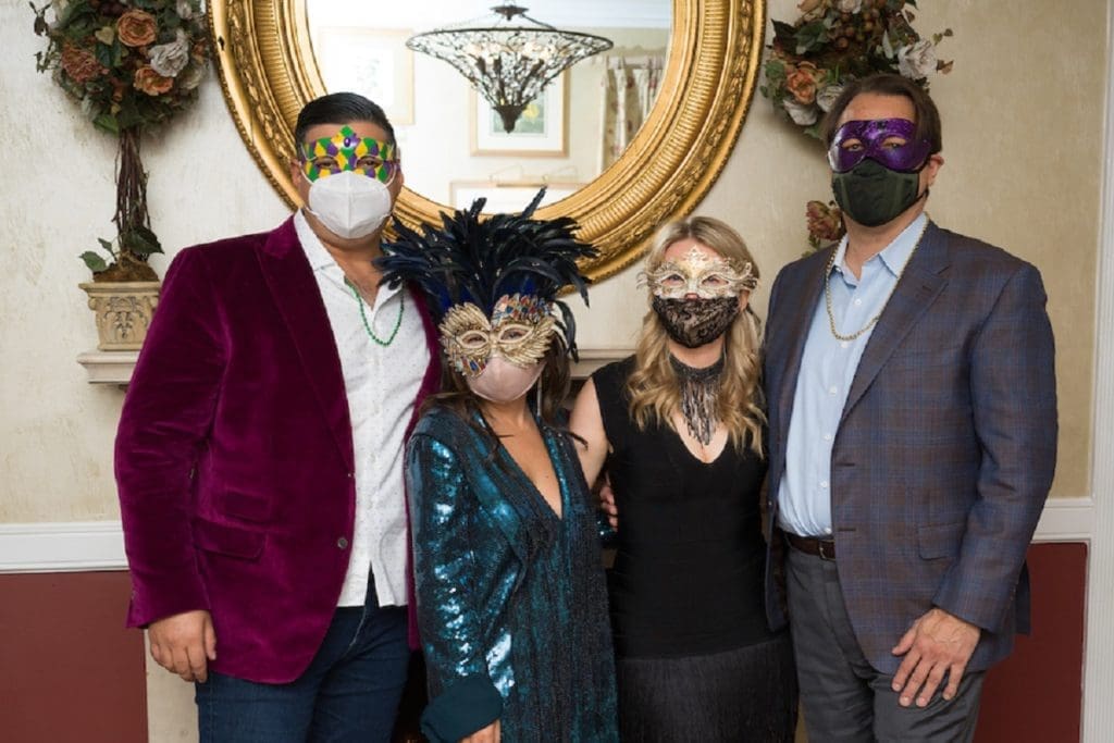 George & Michelle Farah, Oksana Kantara, Brandon Glasscock double mask up for the Mardi Gras soirée in the Manor House at The Houstonian Hotel, Club & Spa. (Photo by Daniel Ortiz)
