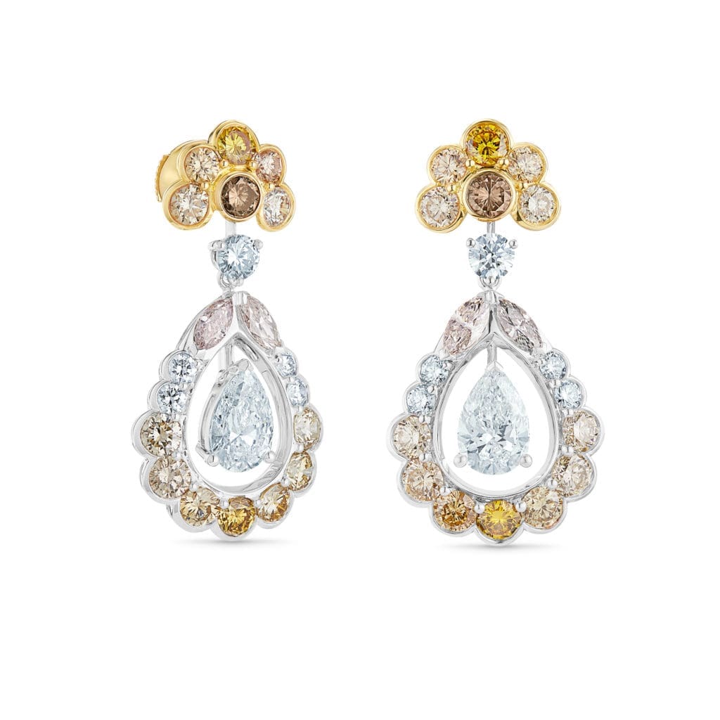 The pear shaped white diamond appears to float freely in the Landers Radiance earrings in white, yellow, pink, grey and orange polished diamonds. (Photo courtesy of De Beers Jewellers)