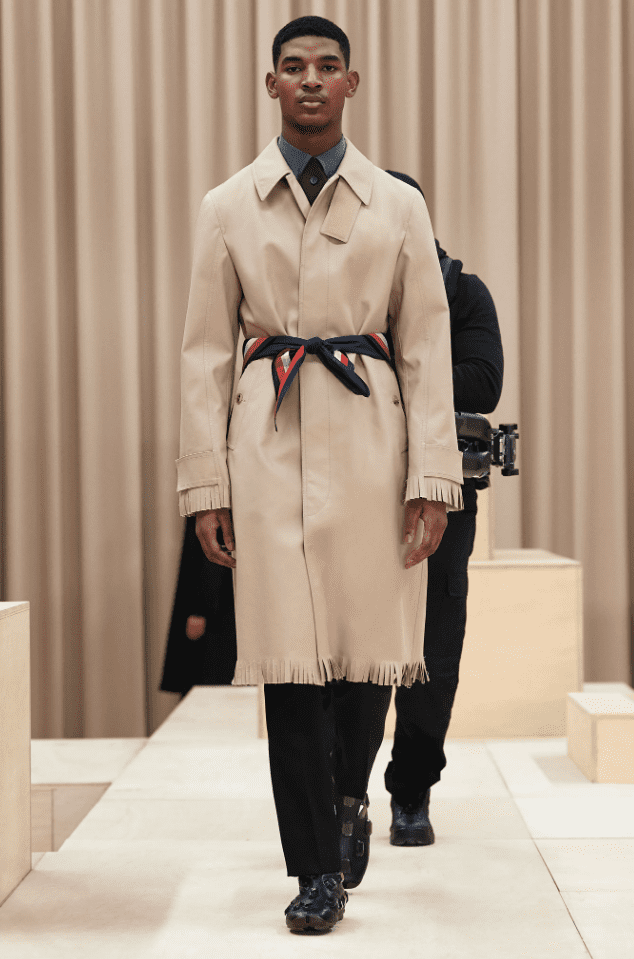 Burberry trench coat with fringe hem and silk scarf cinched at the waist. (Photo courtesy of Burberry)
