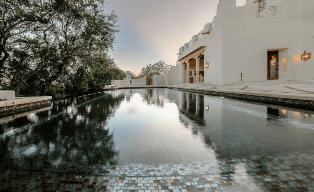 The swimming pool with iridescent tiles is a recent addition to the George Strait home in San Antonio. (Photo by LRES)