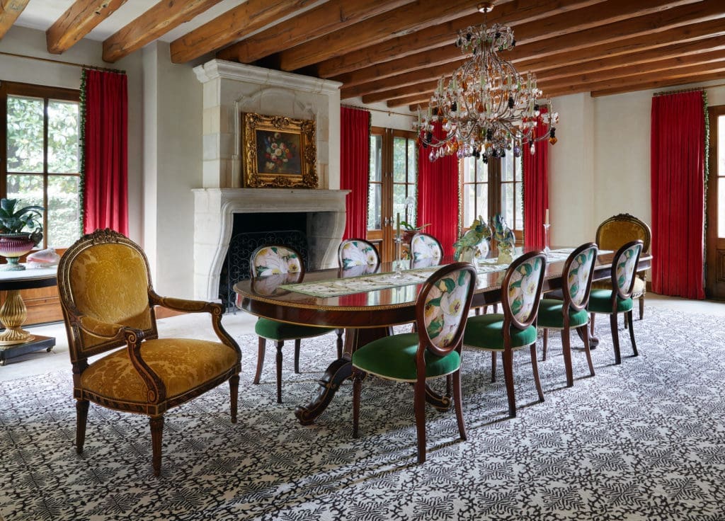 Pierre Frey velvet drapery, Samuel & Sons trim. Nineteenth-century Murano chandelier with glass fruit. Custom-woven rug through James showroom. (Photo by Pär Bengtsson)
