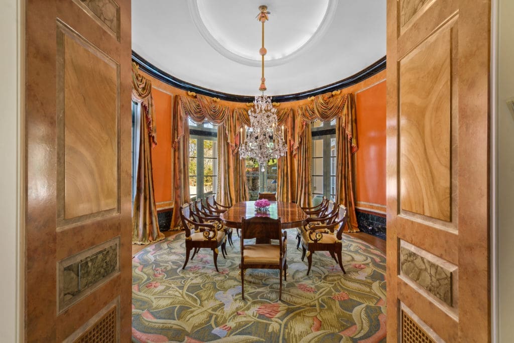 The formal dining room of the Gerald Hines home in River Oaks is interestingly designed in a regal oval shape. (Photo by Sonya Bertolino)