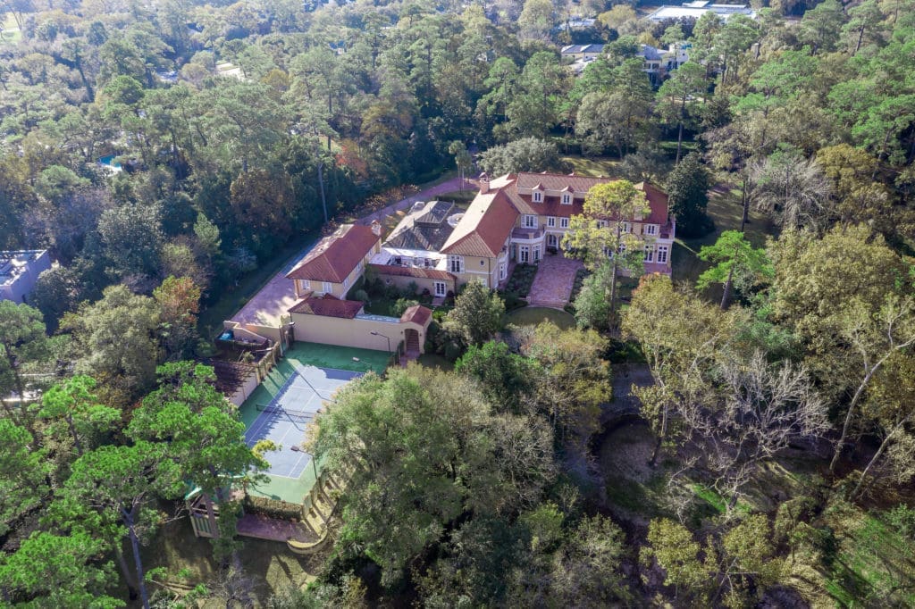 The arial view of the Gerald Hines home in River Oaks reveals a tree-shaded estate spread across 4.5 acres. (Photo by Sonya Bertolino)