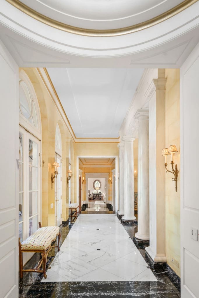 The marbled hallway of the Gerald Hines home opens to the living room on the right and the terrace on the left. (Photo by Sonya Bertolino)