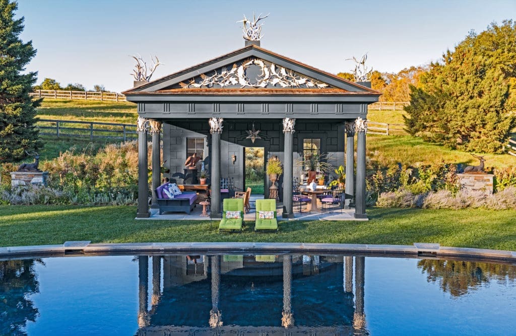 Pool house inspired by a rustic temple on the grounds of Arundel Castle in West Sussex, England.