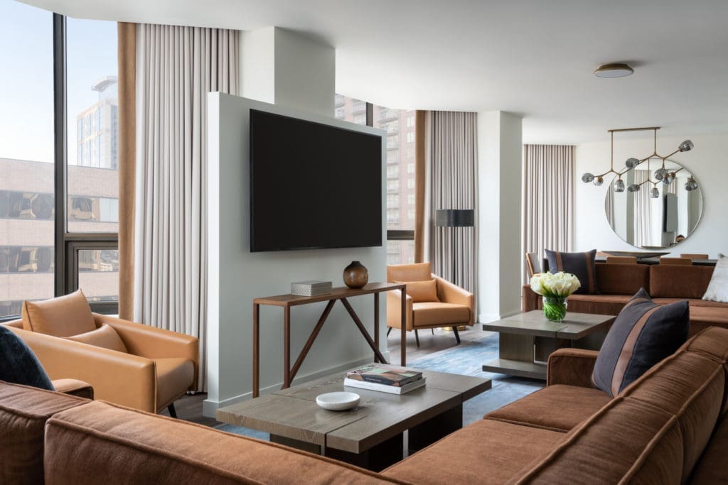 Decor in the Four Seasons Hotel Houston Presidential Suite reflects a Texas esthetic in a camel and blue palette, the work of Rottet Studio. (Photo by Four Seasons Hotel Houston)