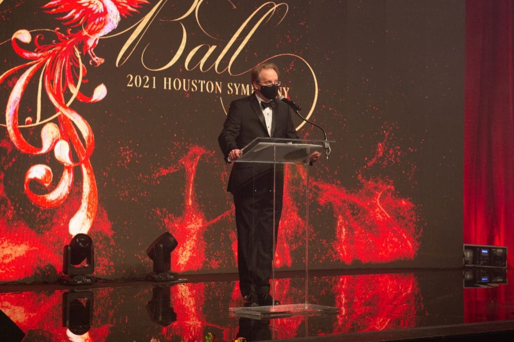 Masked in precaution against COVID-19, Houston Symphony CEO John Mangum addresses symphony ball guests at the Post Oak Hotel. (Photo by Wilson Parish)