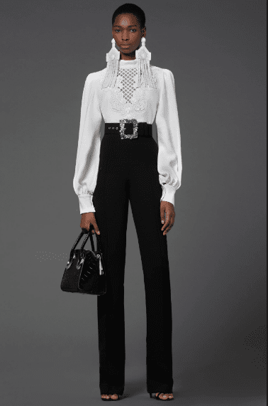 Andrew Gn white lace blouse, place trousers, shoulder duster earrings. (Photo courtesy of Andrew Gn)