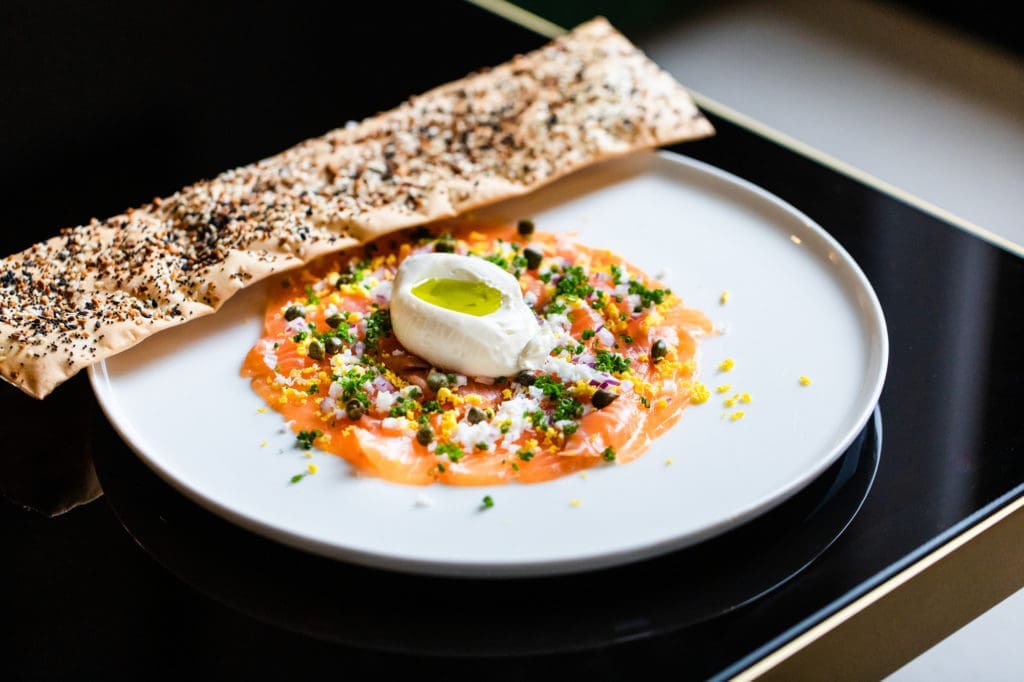 Salmon Gravlax Carpaccio is on the menu at La Colombe d'Or's Tonight & Tomorrow restaurant. (Photo courtesy of La Colombe d'Or)