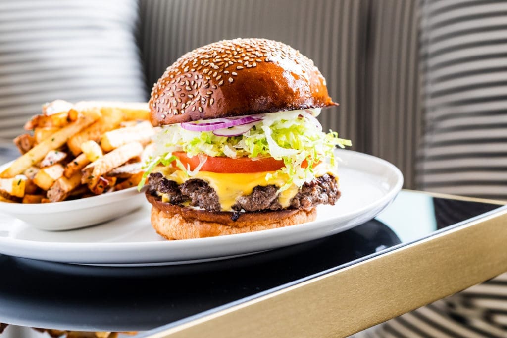 A classy cheese burger is on the menu at La Colombe d'Or's Tonight & Tomorrow restaurant. (Photo courtesy of La Colombe d'Or)