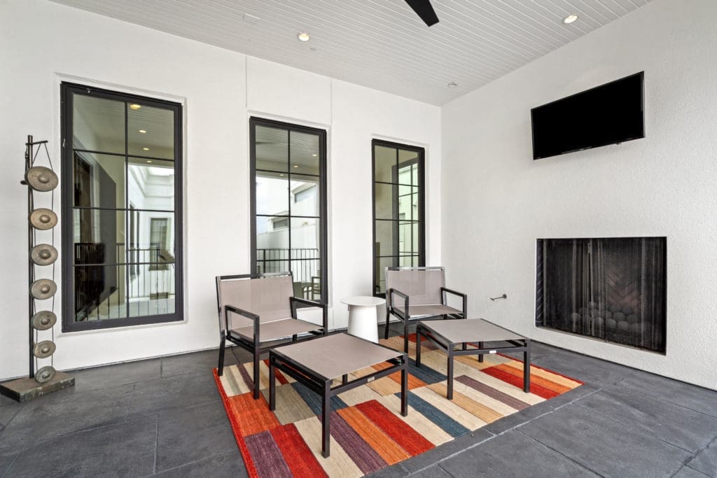 An outdoor terrace with fireplace on the second floor of the home at 2521 Westgate. (Photo by Sonya Bertolino)