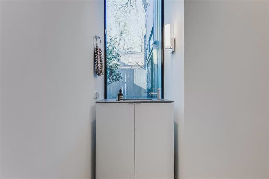 The East Village home includes two full bathrooms and one half bath. 