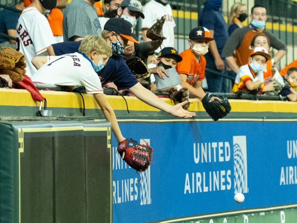 The kids are back in Minute Maid Park — and a half full stadium never seemed more celebratory. (Photo by F. Carter Smith)