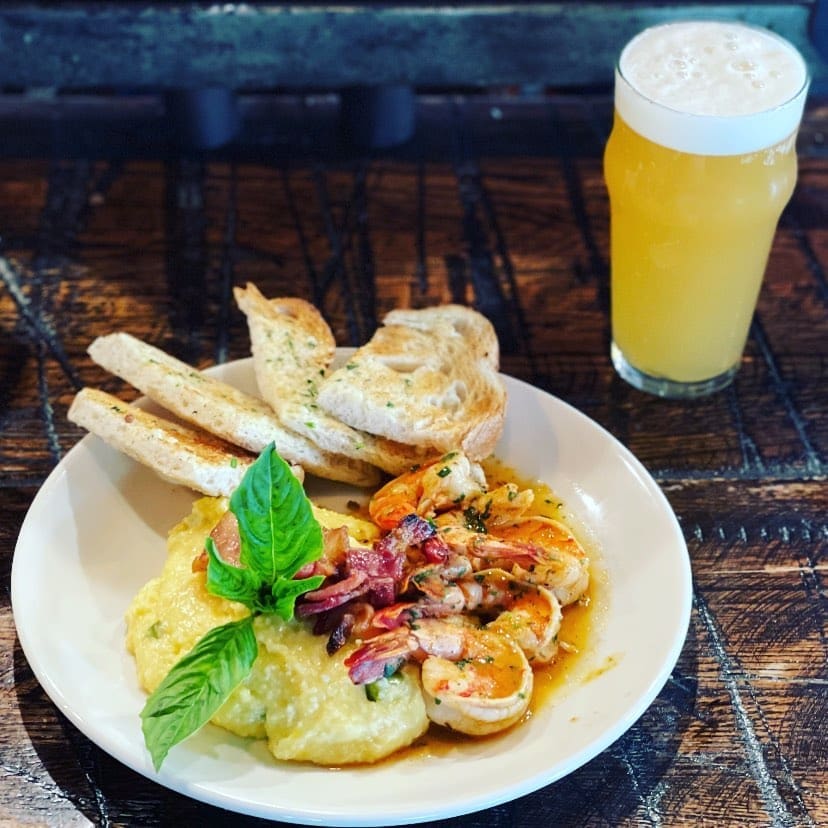 Fort Worth diners can look forward to Bankhead Brewing Company's shrimp and jalapeño grits finished with bacon, and Foglights, a New England IPA. (Courtesy of Bankhead)