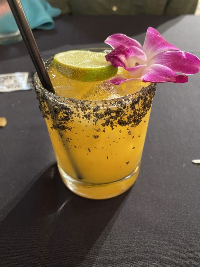 The La Khalo cocktail at Ocho Latin Cuisine is a spicy and sweet mix of mezcal, lemon juice, passion fruit puree, and chile morita syrup. (Photo by Megan Ziots)