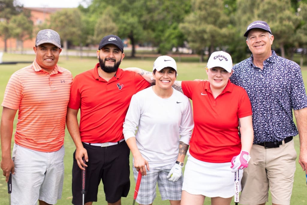 Jose Canales, Enrique Montes, women's MMA fighter Jessica Aguilar, Shannan Canales, Tom Whitehead at the Lucille's 1913 golf tournament awards dinner at Hermann Park Golf Course. (Photo by Leah Wilson)