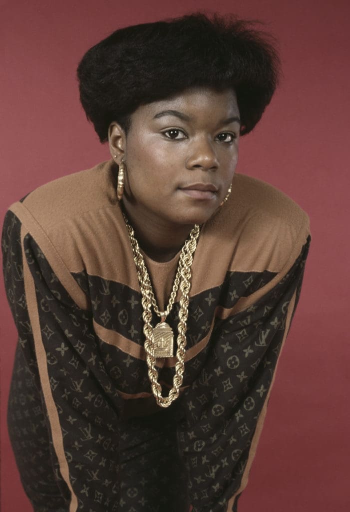 Fashion is a prime example of defining oneself and has played a large role in shaping America's identity. American hip hop musician and rapper Roxanne Shante, wearing an outfit by Dapper Dan, circa 1989. (Photo by Michael Ochs Archives/Getty Images)
