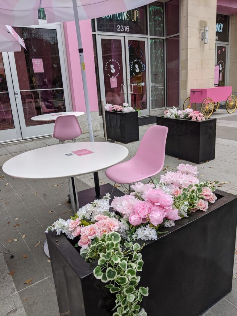 The cutest outdoor seating outside the Sweet Tooth Hotel welcomes you.