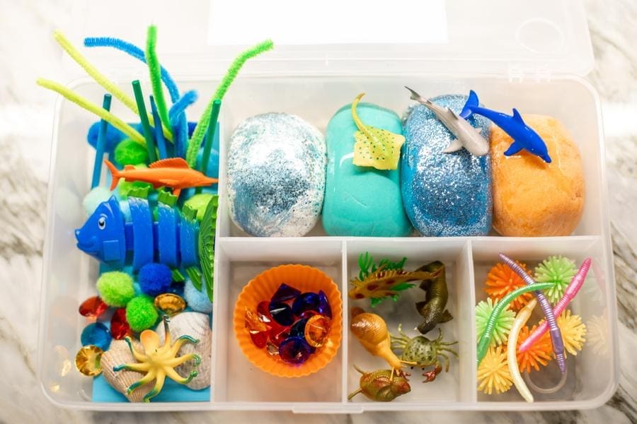 The bottom of the deep blue sea sensory bin by The Mastin Project will keep kids engaged.