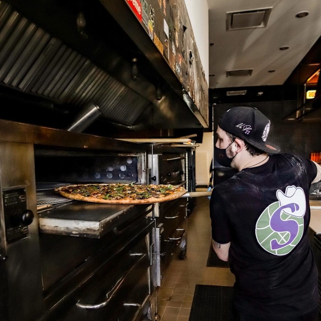 Another Seriously Large pizza going into the oven.