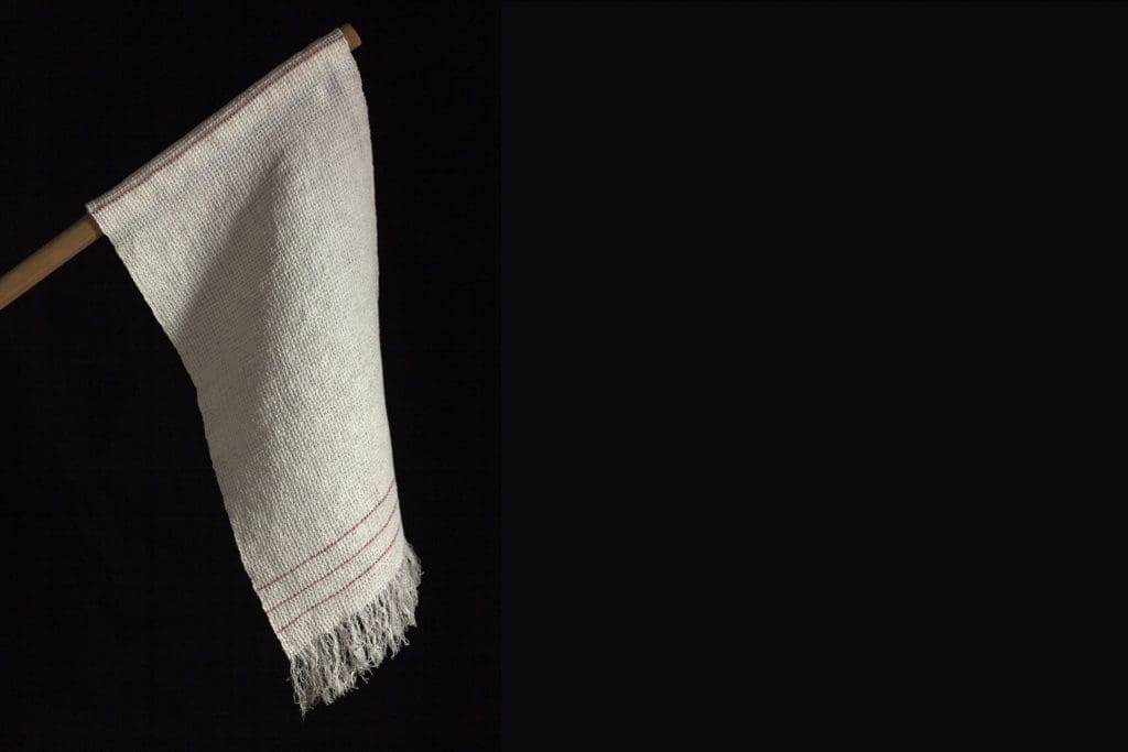 Sonya Clark an American fiber artist of Afro-Carribean heritage uses different material and objects to shed light on personal and cultural stories. In collaboration with the Fabric Workshop and Museum, Philadelphia, Sonya Clark's woven replica of the Confederate Flag of Truce, 2019. (Photo by Carlos Avendaño) 