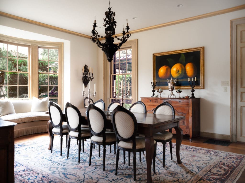 The home in Houston's exclusive Broadacres neighborhood was designed by John Staub, construction completed in 1930. Here, the formal dining room which looks out to the verdant backyard though a semicircular bay of triple-hung windows.  (Photo by Jonathan Calvert)