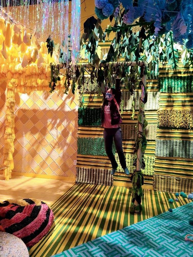 All hard surfaces are up for grabs. Come in for a swing like Rachel Birdwell is here at Molly Sydnor's "Temporal Jungle." (Photo by Crystal Correa)