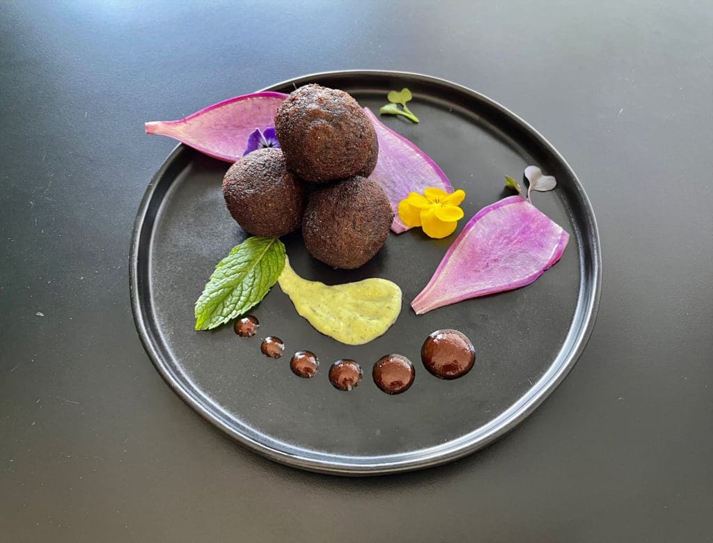 Aloo Tikki with purple potato and goat cheese at Âme in Bishop Arts.