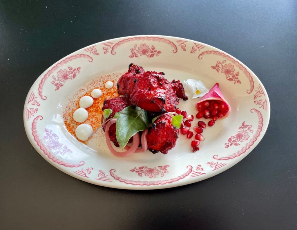 Anari chicken with pomegranate seeds, yogurt, and ginger at Âme. 
