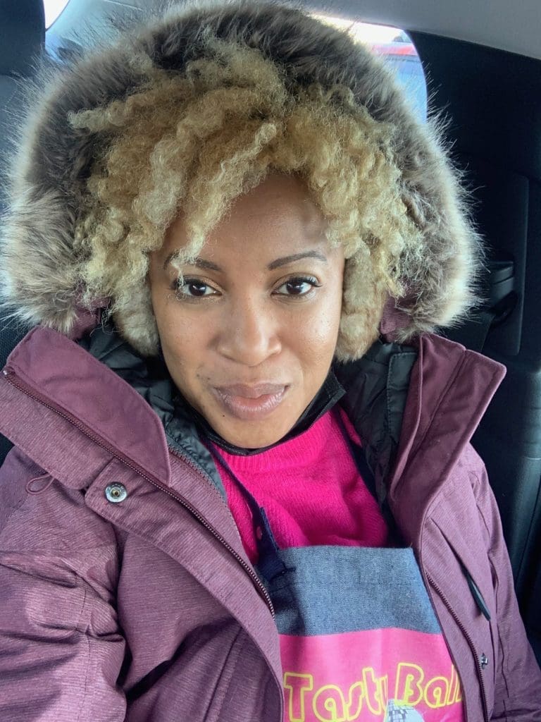 Misti Buard showing off her curls and her Alaska fashion before the deep freeze.