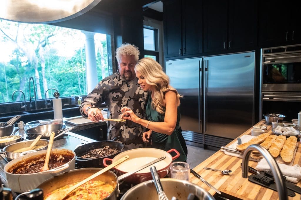 Food Network star chef Guy Fieri gives Faith Majors a sample taste of the birthday dinner Fieri is cooking for Lee Majors' 82nd birthday.