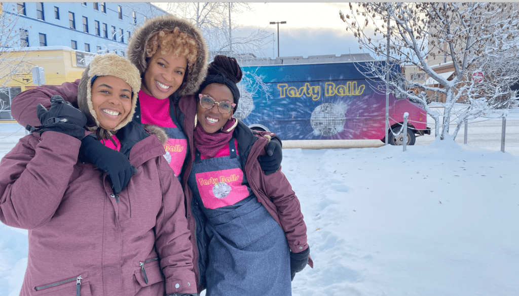 Winners of the Food Network's The Great Food Truck Race: Alaska Houston's Tasty Balls team D'Ambria Jacobs, Mitsi Buard Nadia Ahmed.