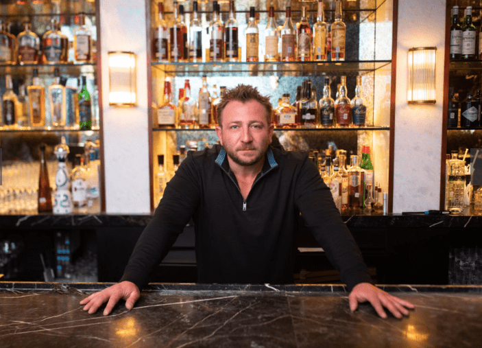 Ben Berg, founder and CEO of Berg Hospitality, in the bar of The Annie. Berg Hospitality restaurants has a lot to offer this spring. (Photo by Leah Wilson)