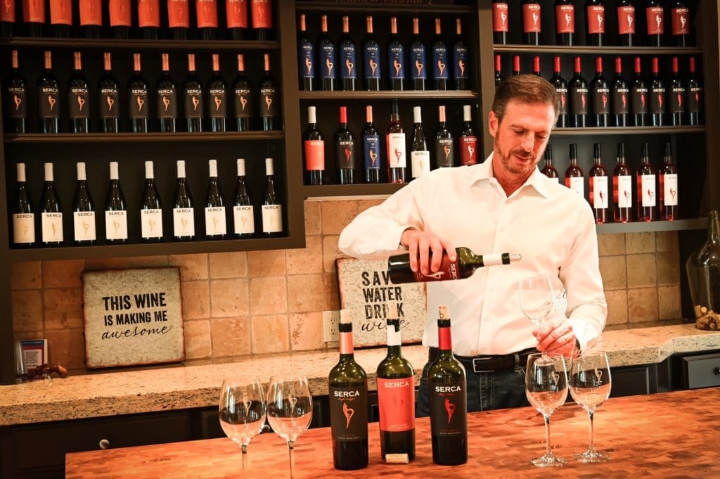 Serca Wines founder Sergio Weitzman pours a sample of his Argentinian Cabernet Franc at the Serca tasting room on Heights Boulevard.