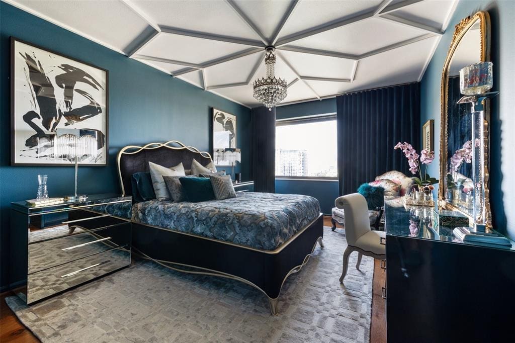 The bedroom ceiling is finished in Moroccan-inspired custom millwork in the 16th floor condo at 1400 Hermann.