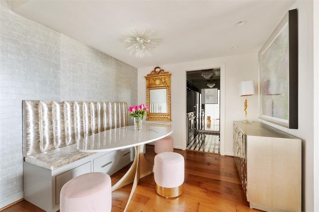 The entry and dining area are defined by metallic textured wall covering in the 16th floor condo at 1400 Hermann. 
