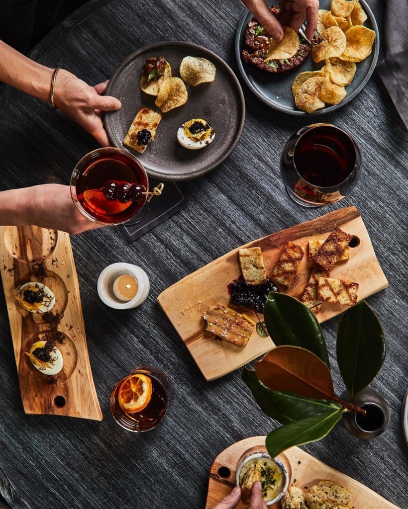 Madeline Hotel's Timber Room serves a 32-ounce Dry-Aged Bison Tomahawk, deviled eggs, and more. (Photo by Madeline Hotel & Residences, Auberge Resorts Collection)