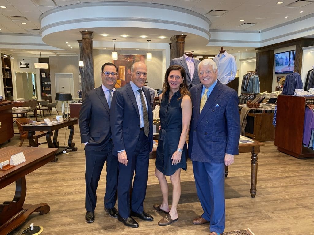 Philip Linkous, architect Carlo Di Nunzio, Shelley Walker Caldwell and Bill Walker take center stage at Bill Walker Clothier's new location in Post Oak Plaza.