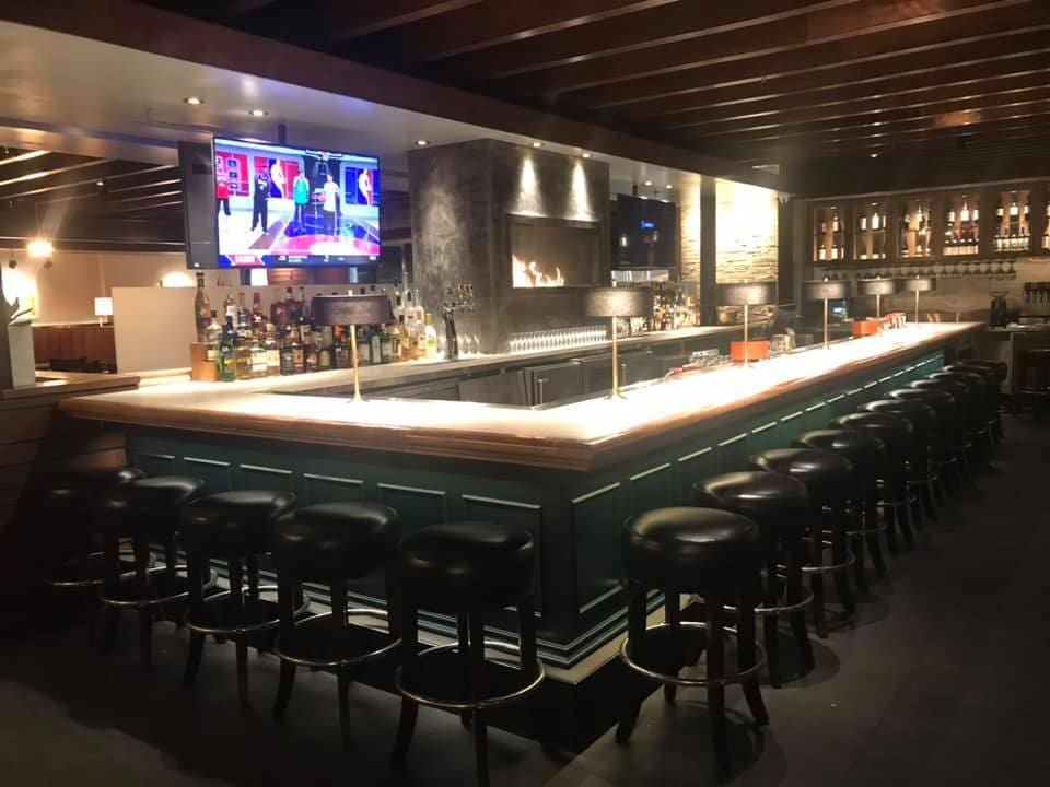 Interior of the new Towne Grill features an oversized L-shaped bar. Photo by 8.10 Construction Solutions. LLC