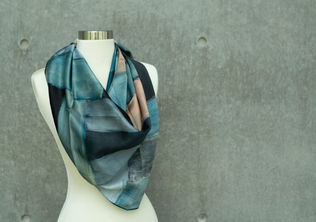 A limited-edition silk scarf based on Scully's painting "Wall of Light Desert Night" is sold in The Modern's Gift Shop.