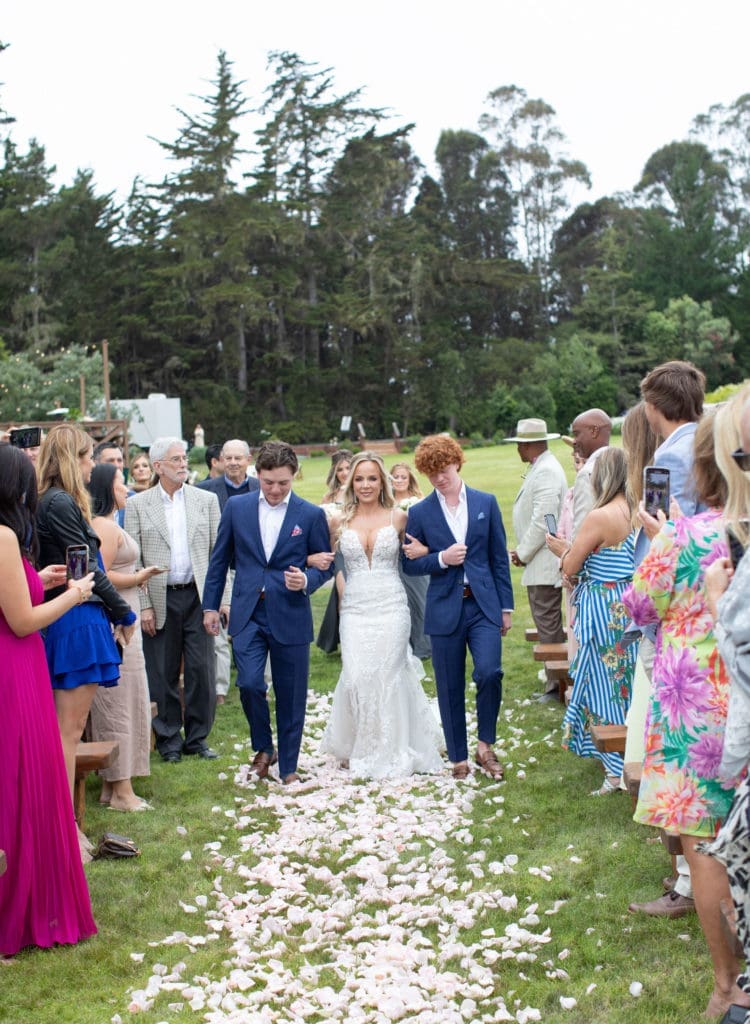 Kim Hausler is escorted to the altar by her sons. (Photo courtesy of @elizabethmessina, www.instagram.com/elizabethmessina)    