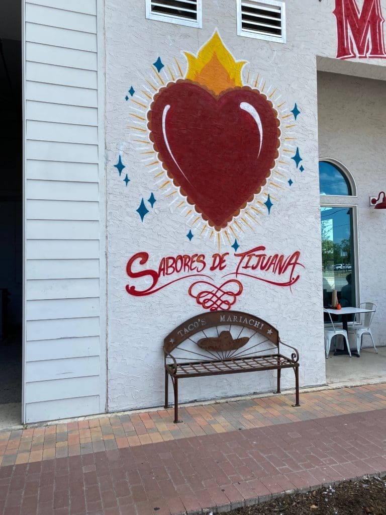 The original Tacos Mariachi bench sits in front of the new spot, Milagro. (Photo by Megan Ziots)