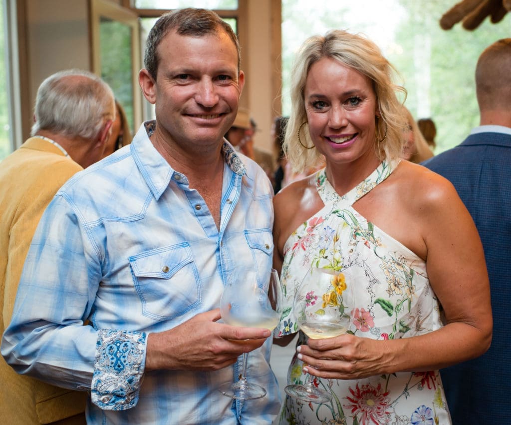 Sotheby's Aspen partner Andrew Light, Erin Lentz, TAG Media Founder and Curated Editor in Chief, at the Exclusive Resorts event at the Aspen home of Glenn Bucksbaum (Photo by Ross Daniels Photography) 