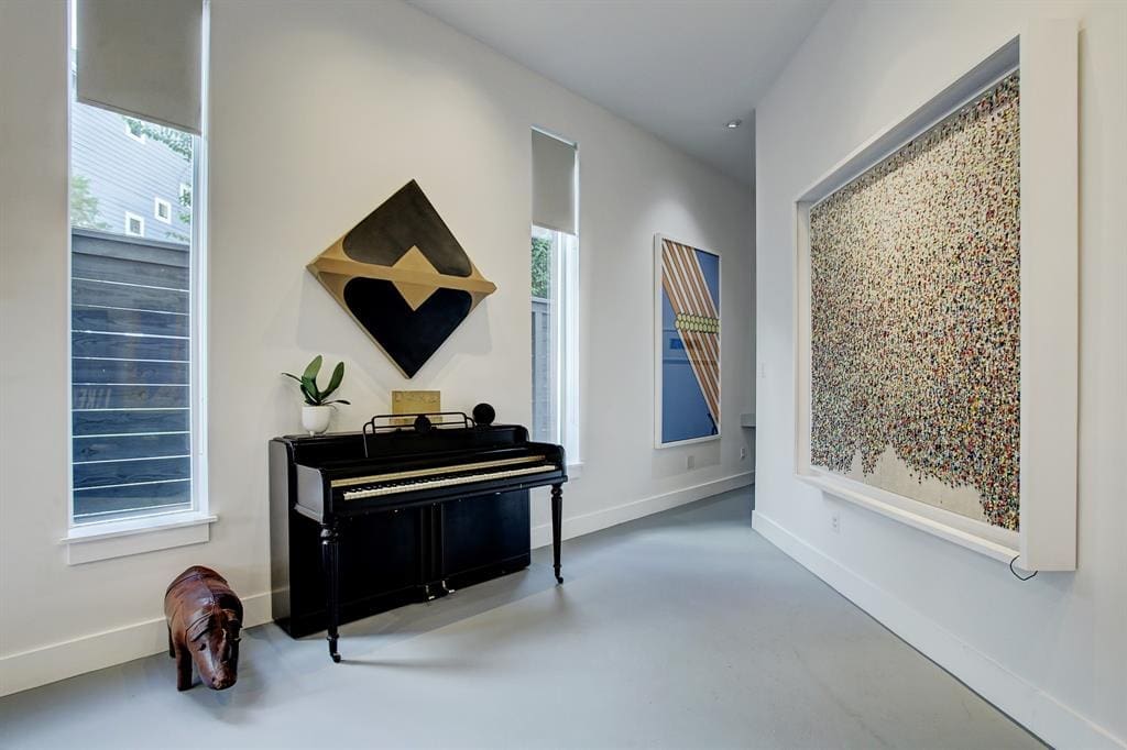Wide wall spaces leading to the powder room create a gallery-like feel. 