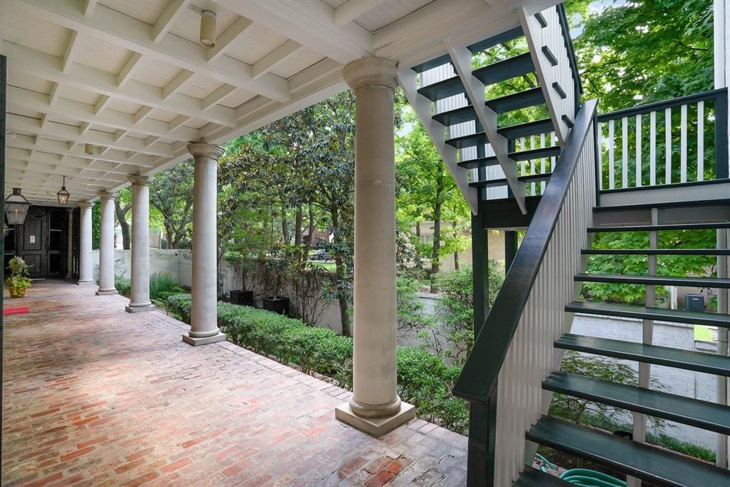 A main entrance located along the side of the home, and a separate stairwell for the spare bedroom. 