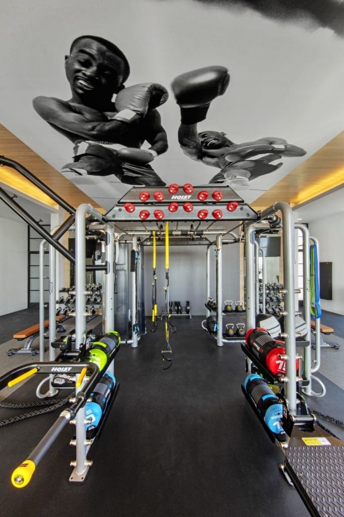 The Victor brings a first class fitness center with all kinds of whimsical touches. Including the boxers on the ceiling. (Photo by  Eric Laigne)