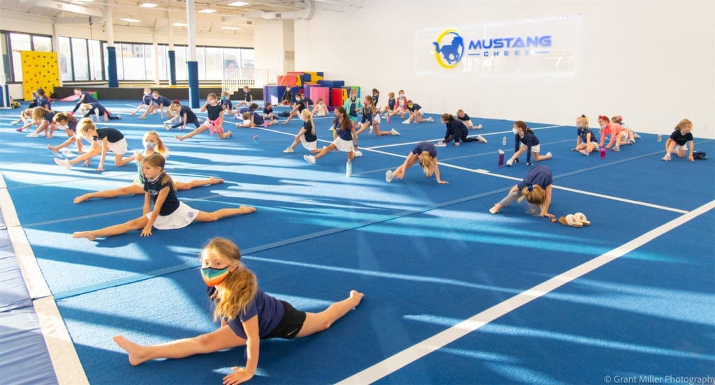 Mustang Cheer is a Dallas cheerleading gym that fosters young athletes and builds self-confidence. (Courtesy of Grant Miller Photography)