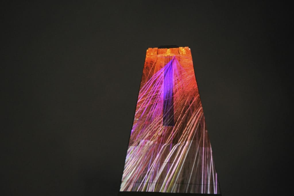 Refik Anadol's massive artwork, Pioneer Tower Dreams, will be projected onto Pioneer Tower.