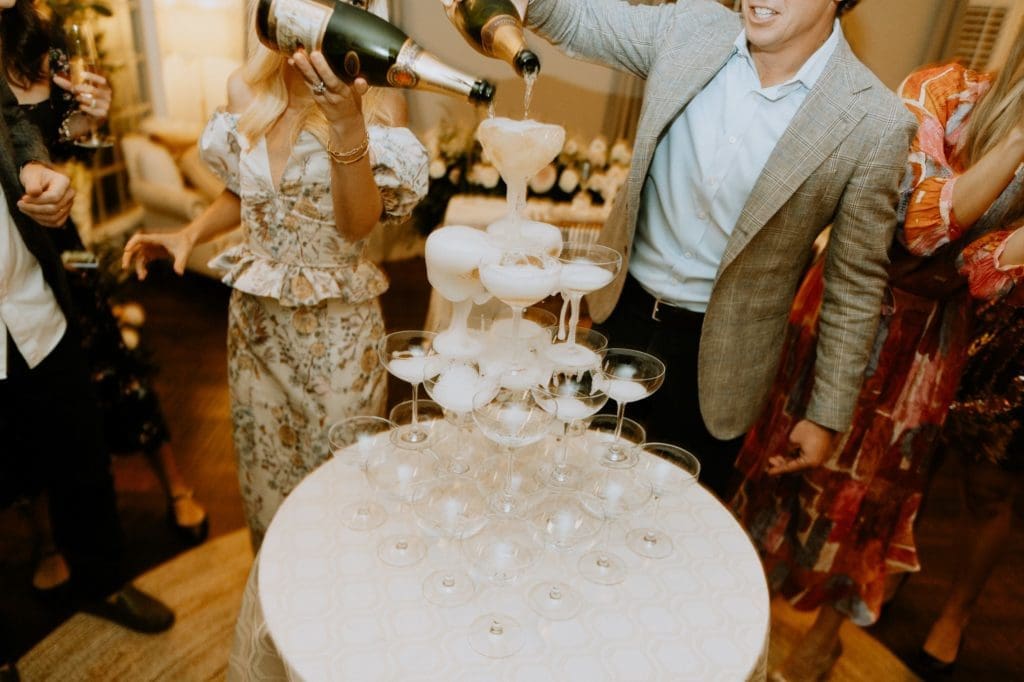Posh Couture Rentals lets the celebration flow with a champagne tower. Photo by Brenden Williams Photography. Planning and Design by Social Llama Events.